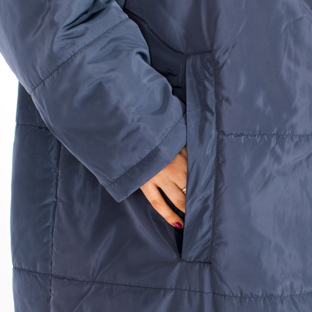 demonstration of the open pocket feature of a sittingsuit